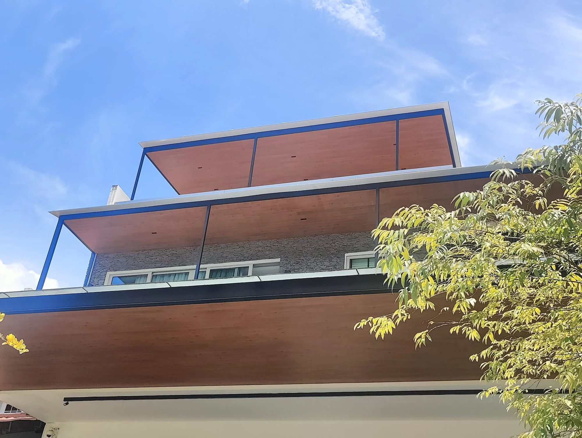 Stacked roof planes, aluminium roof extension installed by Exterior Design in Singapore
