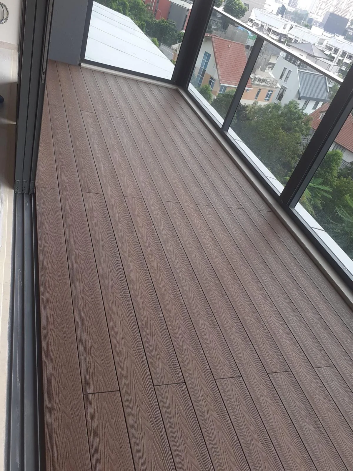 Aluminium decking laid to the glazing, Singapore